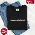 He’s Playing Basketball – Funny Sports Girlfriend Comfort Color Shirt for Women